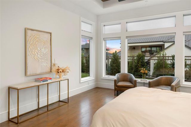 a bedroom with furniture and windows