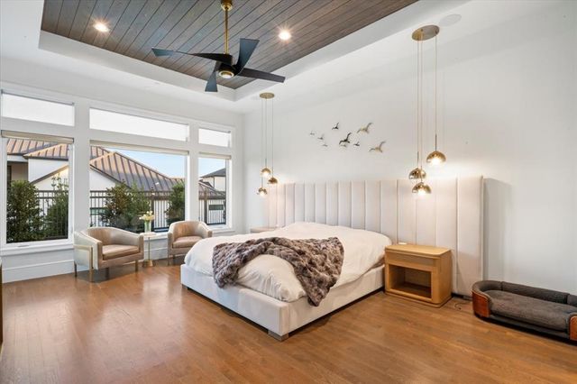 a bedroom with a bed couch and window