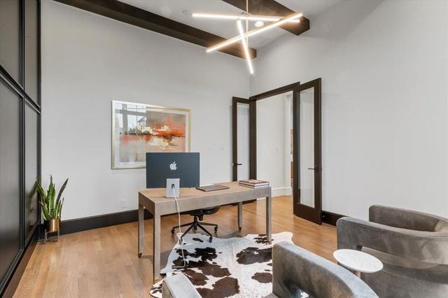 a workspace with furniture and window