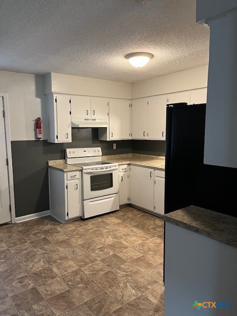 809 Michelle Drive Copperas Cove, TX 76522 - Photo 5 of 12 a kitchen with cabinets and white appliances