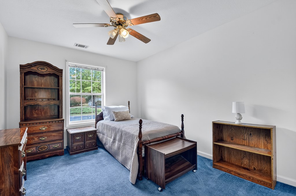 12 Sunset Court Blue Ridge, GA 30513 - Photo 13 of 23 a bedroom with furniture and a window