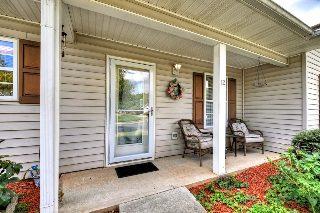 12 Sunset Court Blue Ridge, GA 30513 - Photo 21 of 23 a view of a chair and fire pit in front of a window