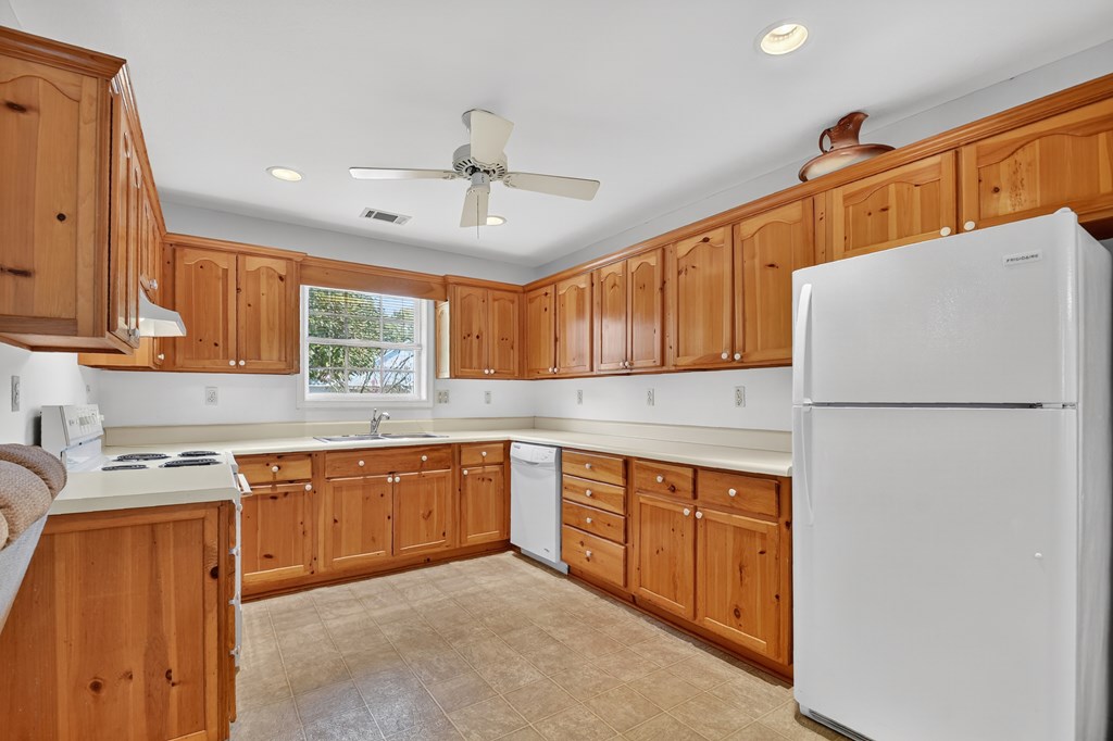 12 Sunset Court Blue Ridge, GA 30513 - Photo 4 of 23 a kitchen with stainless steel appliances granite countertop a refrigerator a sink dishwasher a stove with wooden cabinets and floors