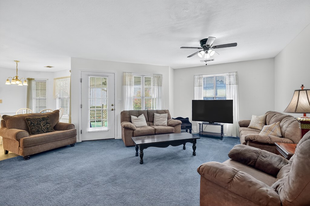 12 Sunset Court Blue Ridge, GA 30513 - Photo 6 of 23 a living room with furniture and a flat screen tv