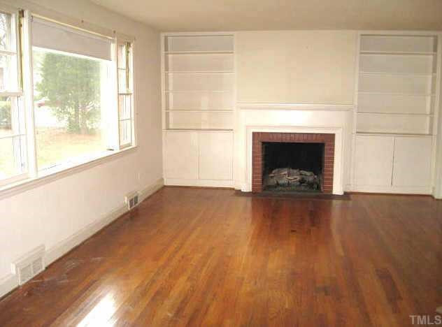 1334 Oberlin Road Raleigh, NC 27608 - Photo 3 of 12 Great living room with large windows, built-ins, gas log fireplace, & hardwoods Other