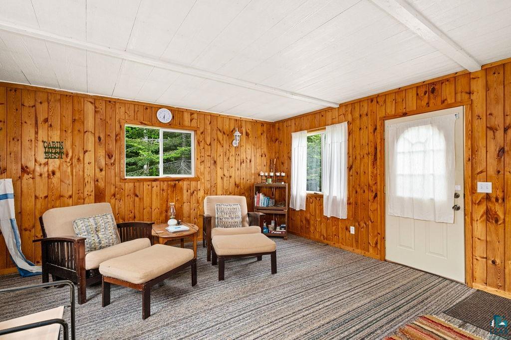 1268 Tom Lake Road Hovland, MN 55606 - Photo 49 of 56 Interior space featuring vertical wood paneling and a white plank ceiling