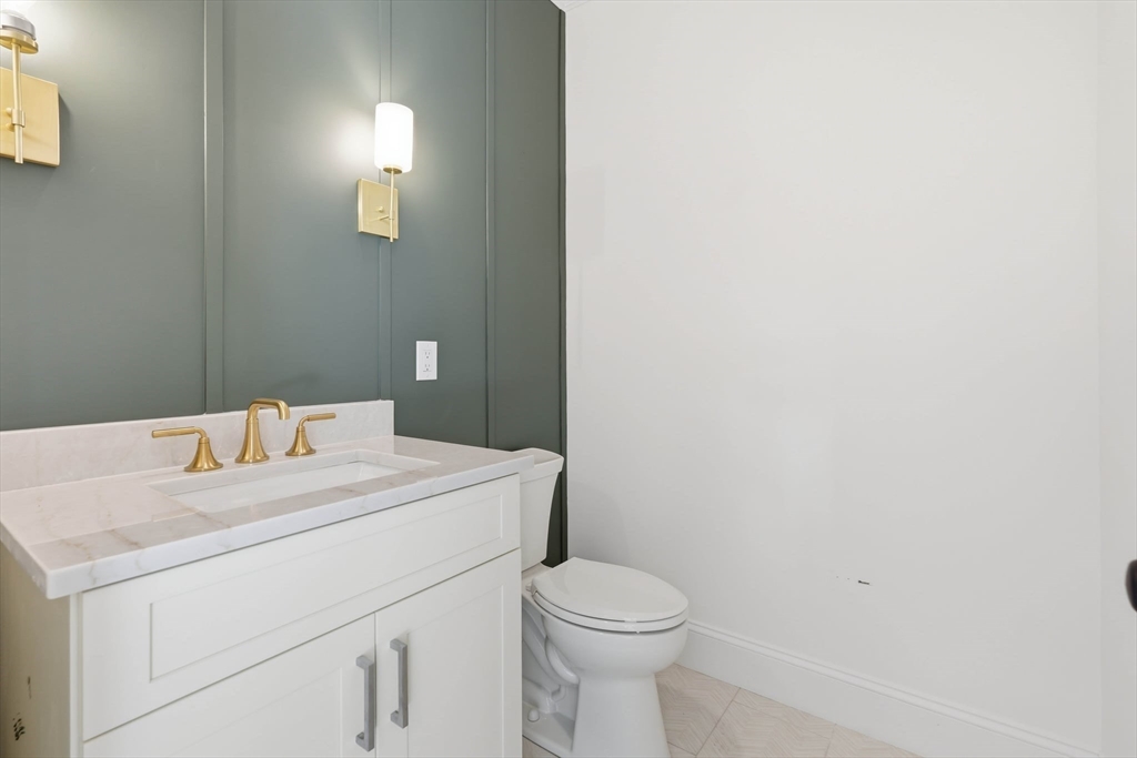 16 Couture Way Middleton, MA 01949 - Photo 16 of 36 a close up of a white toilet sitting next to a white sink