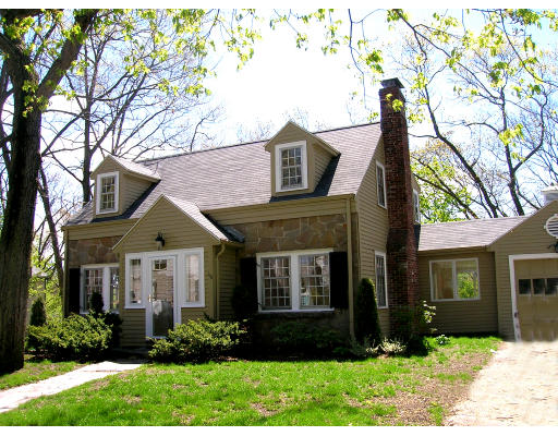 116 Roundwood Road Newton, MA 02464 - Photo 1 of 16 a front view of a house with a yard and outdoor seating