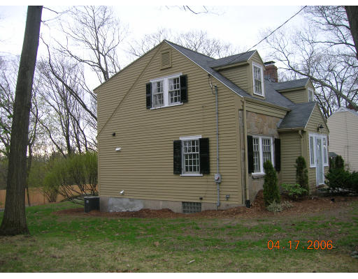 116 Roundwood Road Newton, MA 02464 - Photo 3 of 16 a front view of a house with a yard