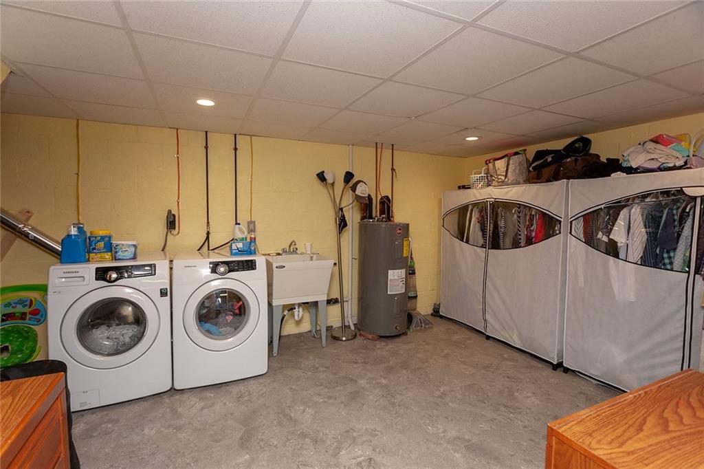 1599 Ridge Road Rostraver Township, PA 15012 - Photo 20 of 25 Large laundry room with new flooring and a drop ceiling.