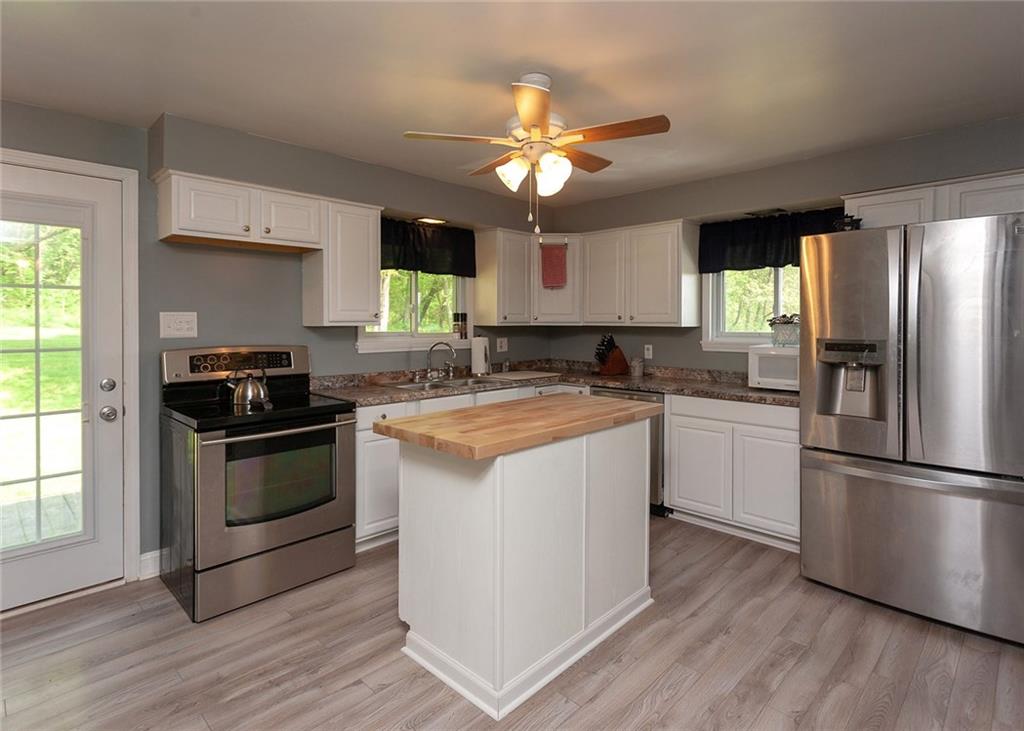 1599 Ridge Road Rostraver Township, PA 15012 - Photo 7 of 25 Beautiful white kitchen with all stainless steel appliances.
