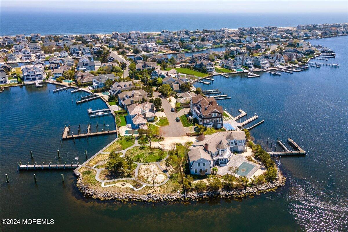 225 Channel Lane Mantoloking, NJ 08738 - Photo 1 of 85 an aerial view of a house with a lake