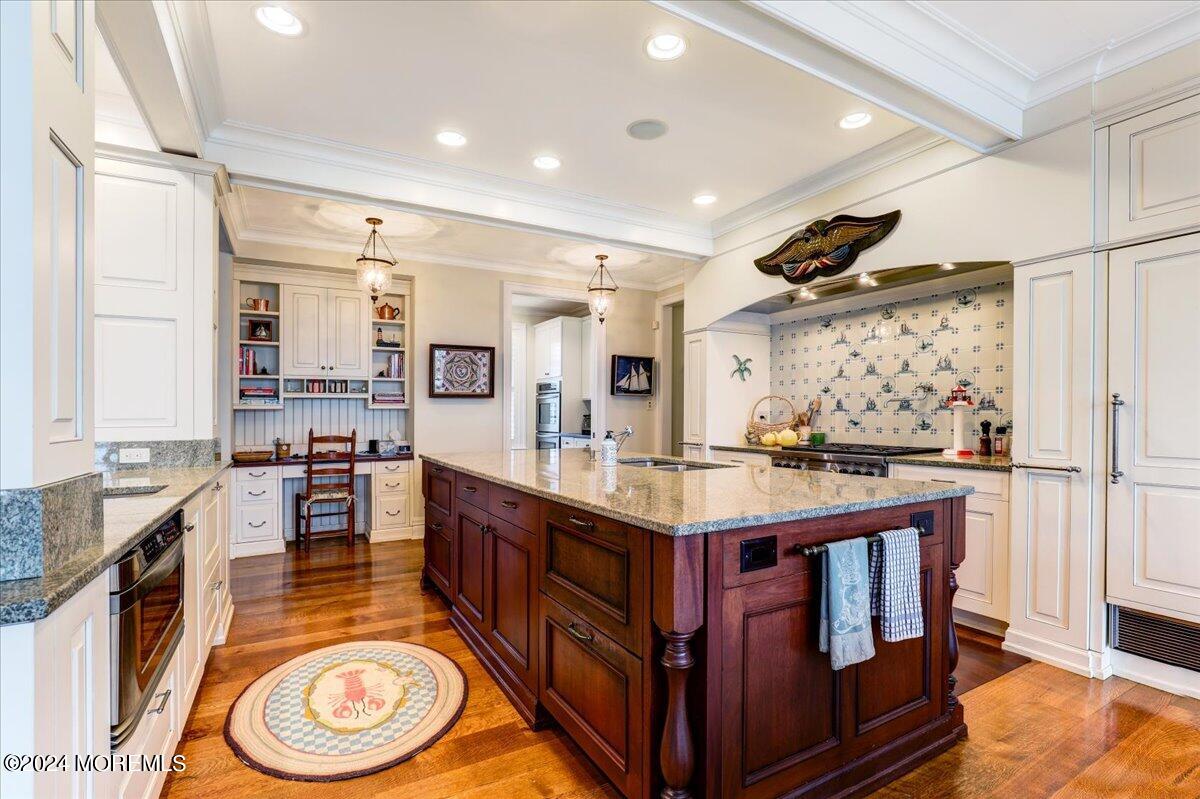225 Channel Lane Mantoloking, NJ 08738 - Photo 12 of 85 a kitchen with stainless steel appliances granite countertop a stove and a sink
