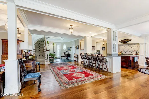 a bathroom with a granite countertop sink mirror vanity and toilet
