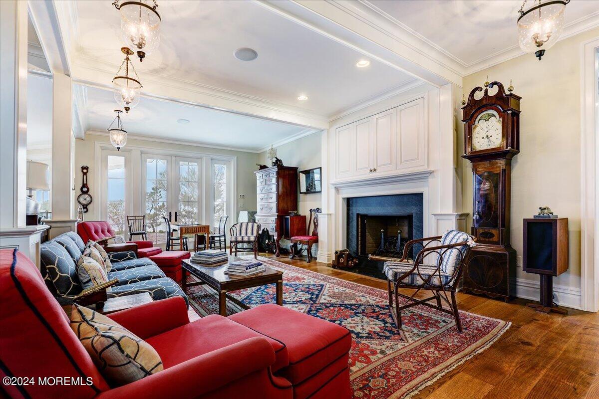 225 Channel Lane Mantoloking, NJ 08738 - Photo 18 of 85 a living room with furniture a fireplace and a window