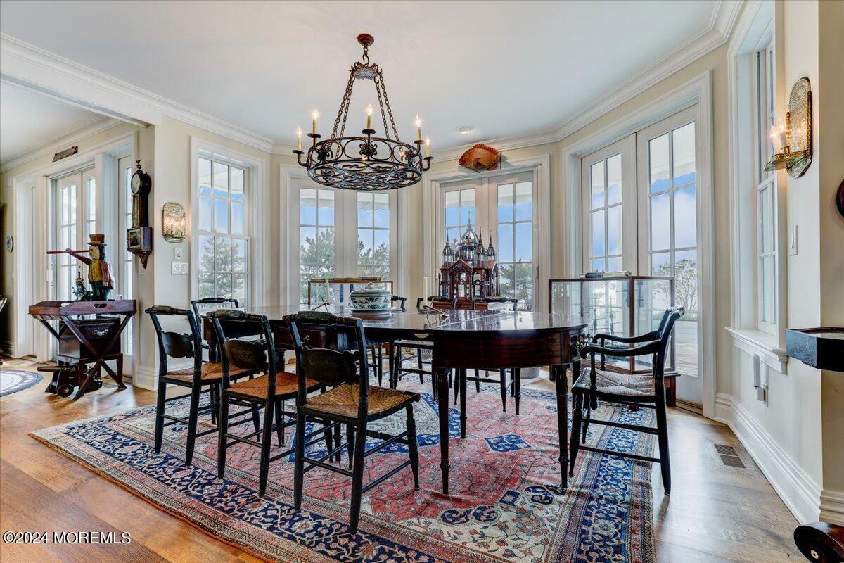 225 Channel Lane Mantoloking, NJ 08738 - Photo 19 of 85 a view of a dining room with furniture window and wooden floor
