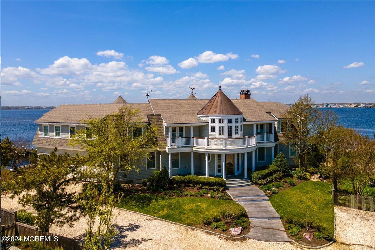 225 Channel Lane Mantoloking, NJ 08738 - Photo 2 of 85 a view of a house with a big yard plants and large tree