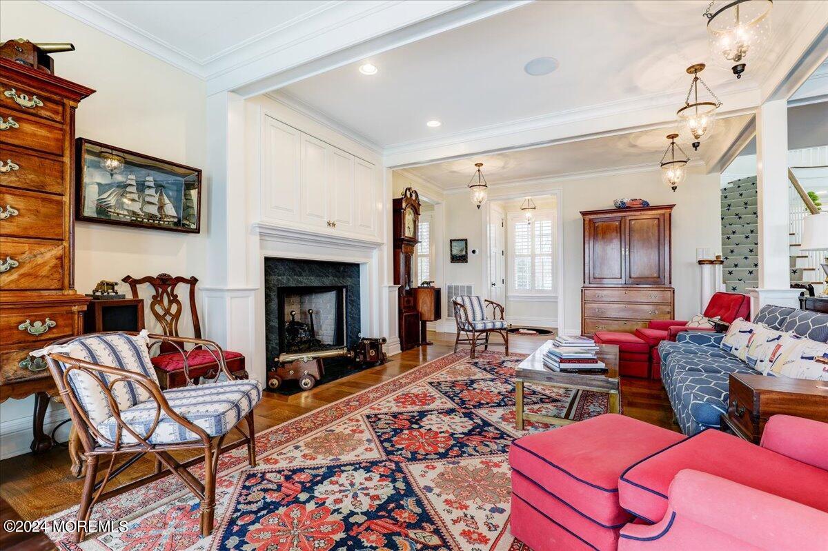 225 Channel Lane Mantoloking, NJ 08738 - Photo 21 of 85 a living room with furniture a rug and a fireplace