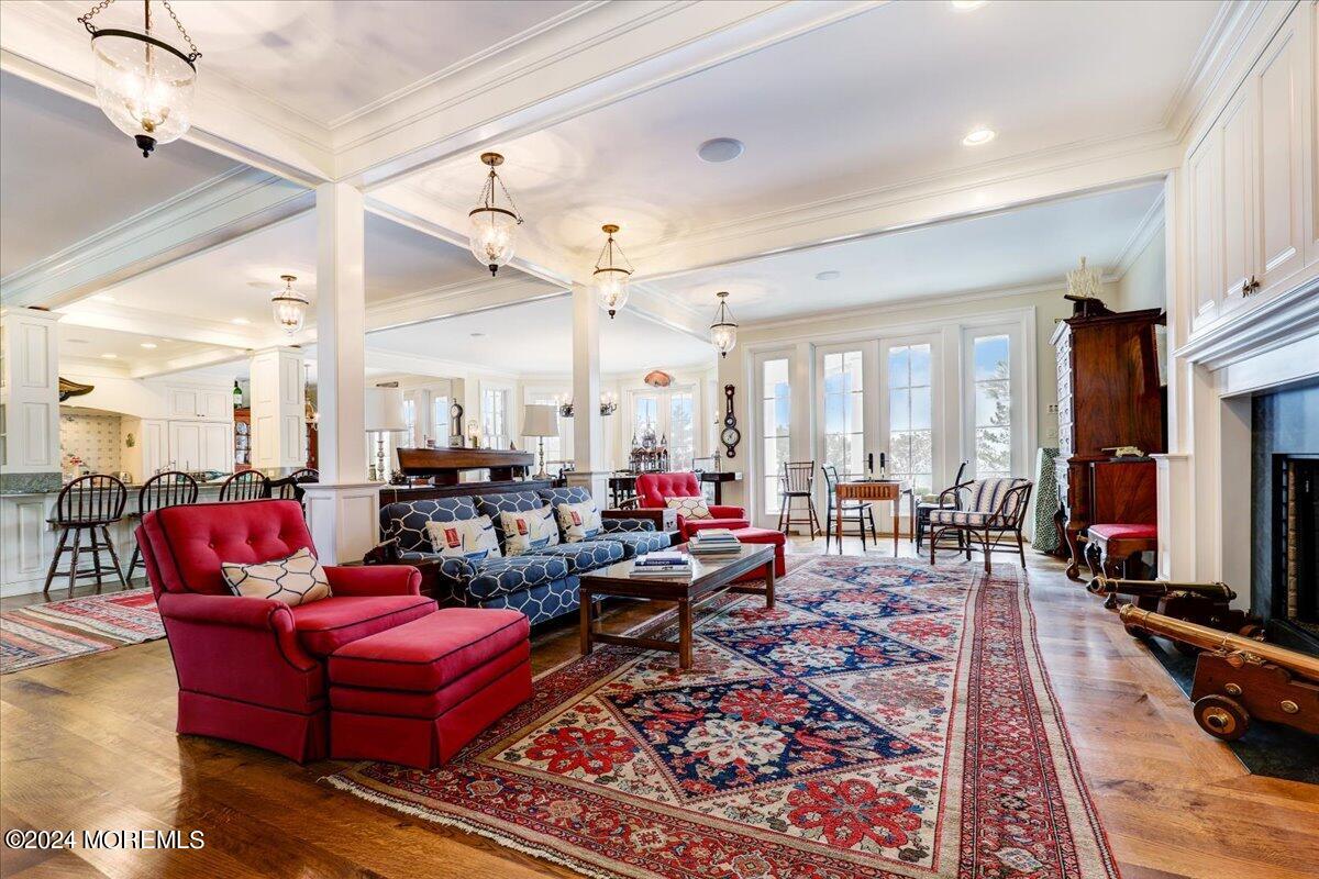 225 Channel Lane Mantoloking, NJ 08738 - Photo 22 of 85 a living room with furniture a flat screen tv and a table