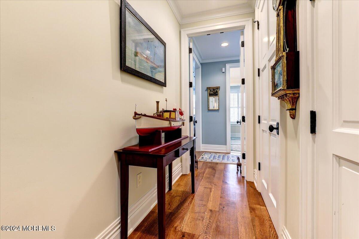 225 Channel Lane Mantoloking, NJ 08738 - Photo 30 of 85 a view of a hallway with wooden floor and furniture