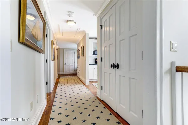 a living room with furniture a rug and a window