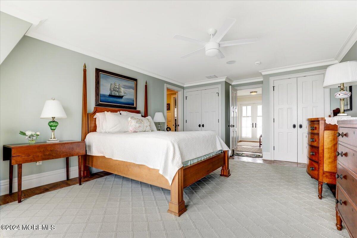 225 Channel Lane Mantoloking, NJ 08738 - Photo 44 of 85 a bed room with a bed and a lamp