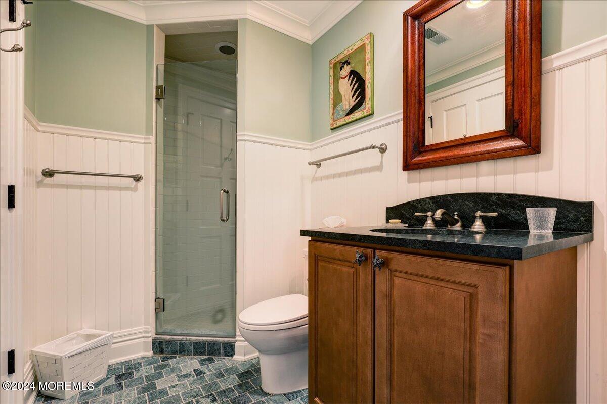 225 Channel Lane Mantoloking, NJ 08738 - Photo 46 of 85 a bathroom with a sink a toilet and shower