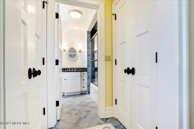 a view of a porch with furniture and a yard