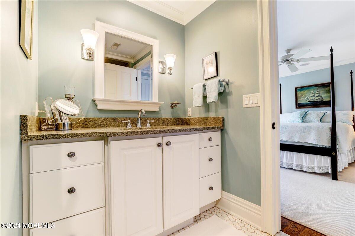 225 Channel Lane Mantoloking, NJ 08738 - Photo 58 of 85 a en suite bathroom with a granite countertop sink and a mirror