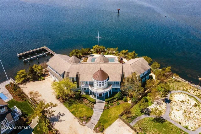 a large kitchen with stainless steel appliances granite countertop a stove and a center island