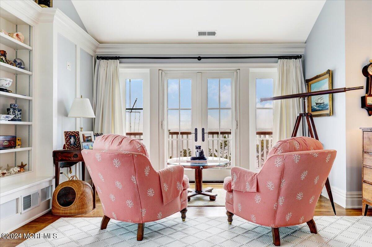 225 Channel Lane Mantoloking, NJ 08738 - Photo 65 of 85 a living room with furniture a rug and a window