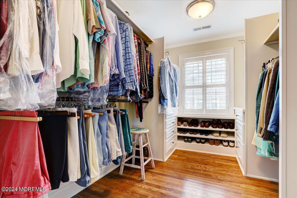225 Channel Lane Mantoloking, NJ 08738 - Photo 66 of 85 a view of walk in closet with clothes and shoes