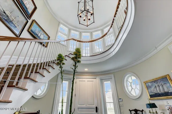 a kitchen with white cabinets and appliances