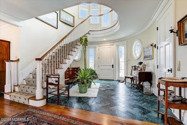 a living room with furniture rug and windows