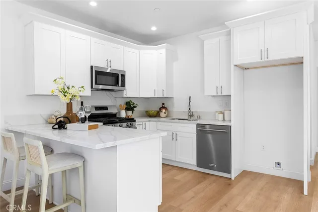 a view of a livingroom with furniture and a potted plant