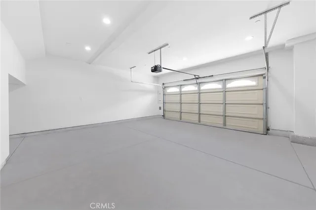 a view of a tennis court with a garden