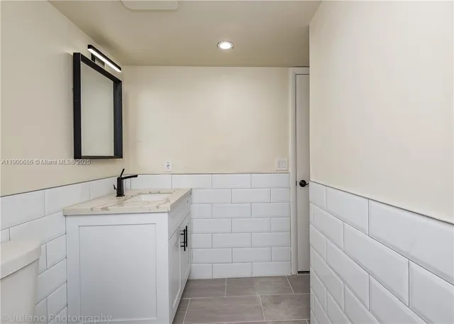 a bathroom with a sink and mirror