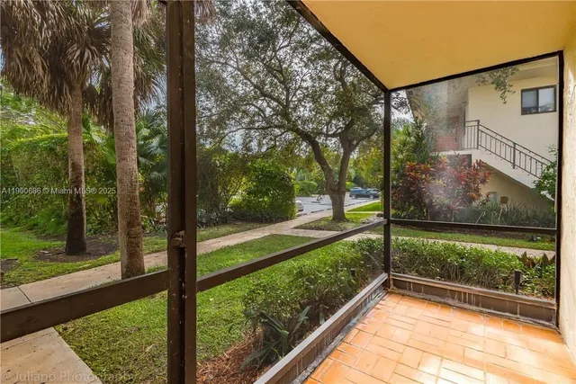 a view of a porch and a yard