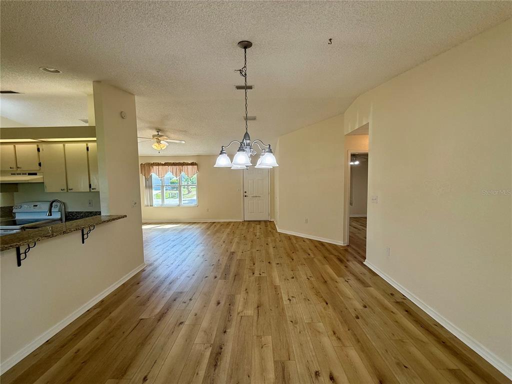 8287 Southwest 116th Street Ocala, FL 34481 - Photo 14 of 40 a view of a room with wooden floor and a window