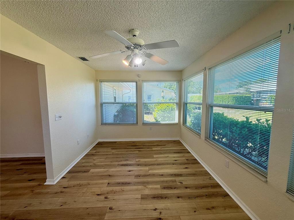 8287 Southwest 116th Street Ocala, FL 34481 - Photo 35 of 40 a view of an empty room with a fireplace and a window