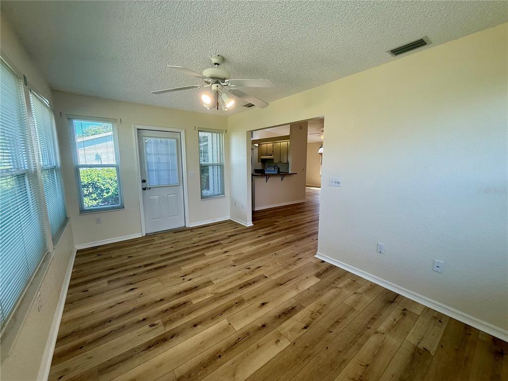 8287 Southwest 116th Street Ocala, FL 34481 - Photo 36 of 40 wooden floor in an empty room with a window