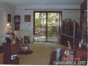 375 Riddle Cove Road Maggie Valley, NC 28751 - Photo 7 of 10 a room with furniture and a floor to ceiling window