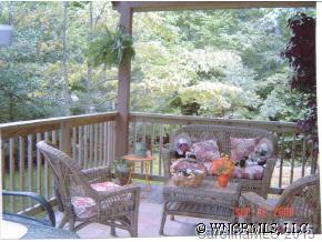 375 Riddle Cove Road Maggie Valley, NC 28751 - Photo 8 of 10 a view of a porch with a bench