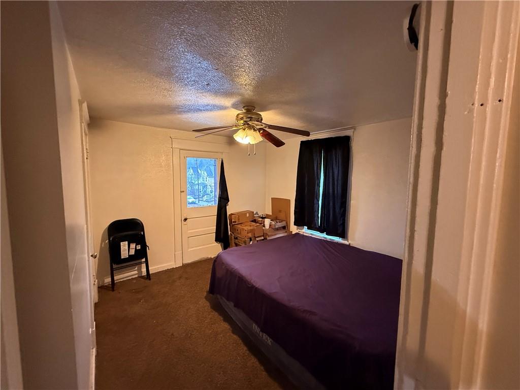 346 Mercer Street Butler, PA 16001 - Photo 12 of 19 a bedroom with a bed and a chair