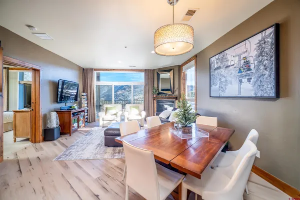 a bathroom with a granite countertop sink toilet and a mirror