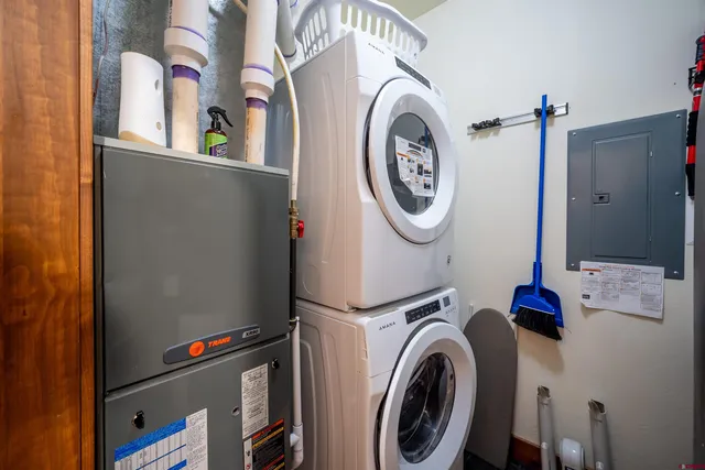 a view of storage and utility room with washer and dryer