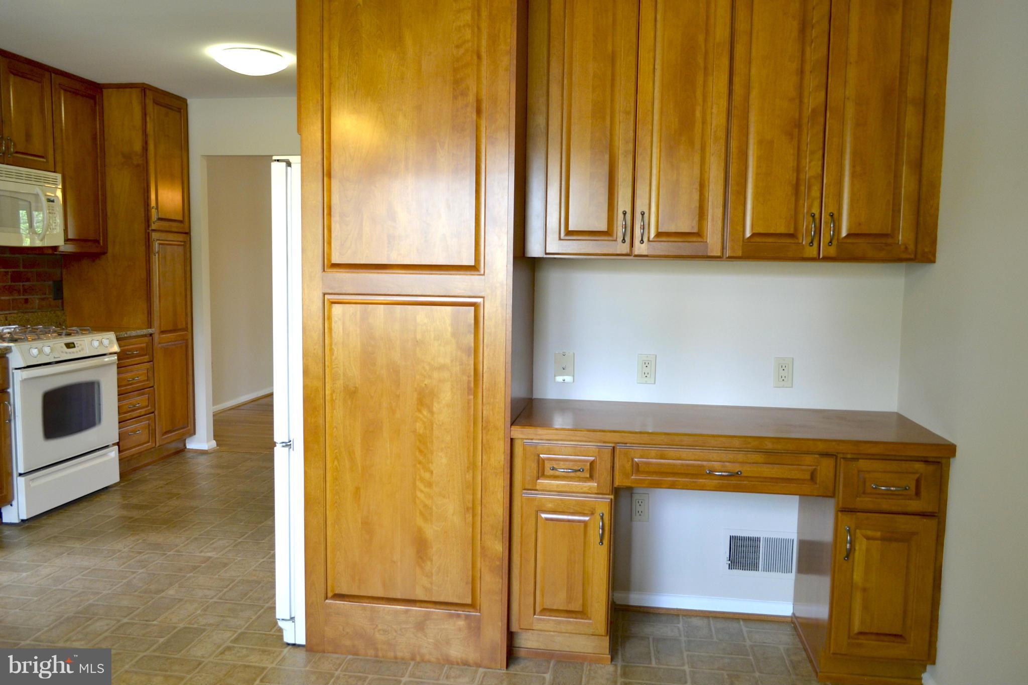 11607 Amherst Avenue Silver Spring, MD 20902 - Photo 5 of 30 Built in desk in kitchen