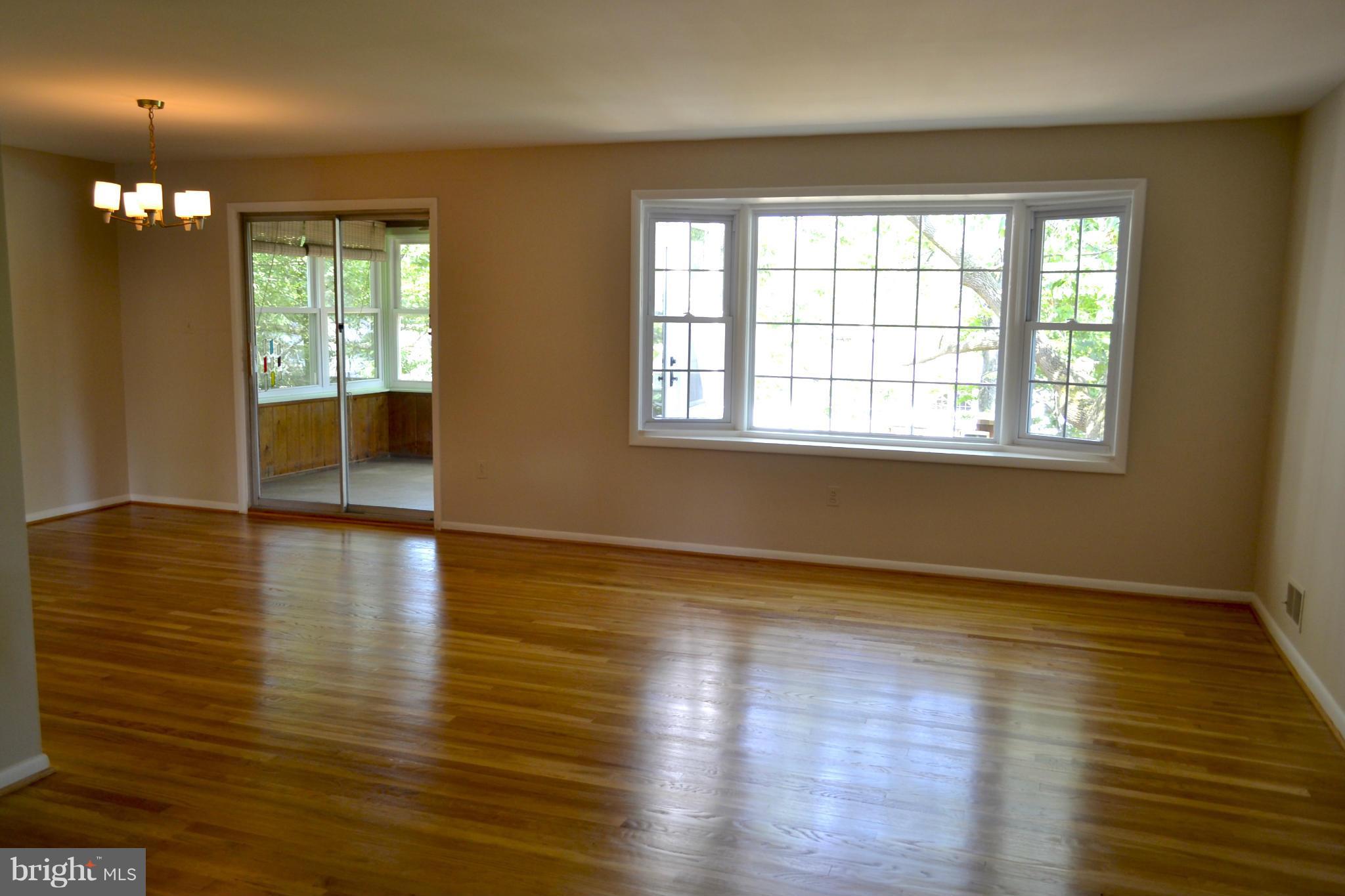 11607 Amherst Avenue Silver Spring, MD 20902 - Photo 6 of 30 Living room with bay window overlooking backyard