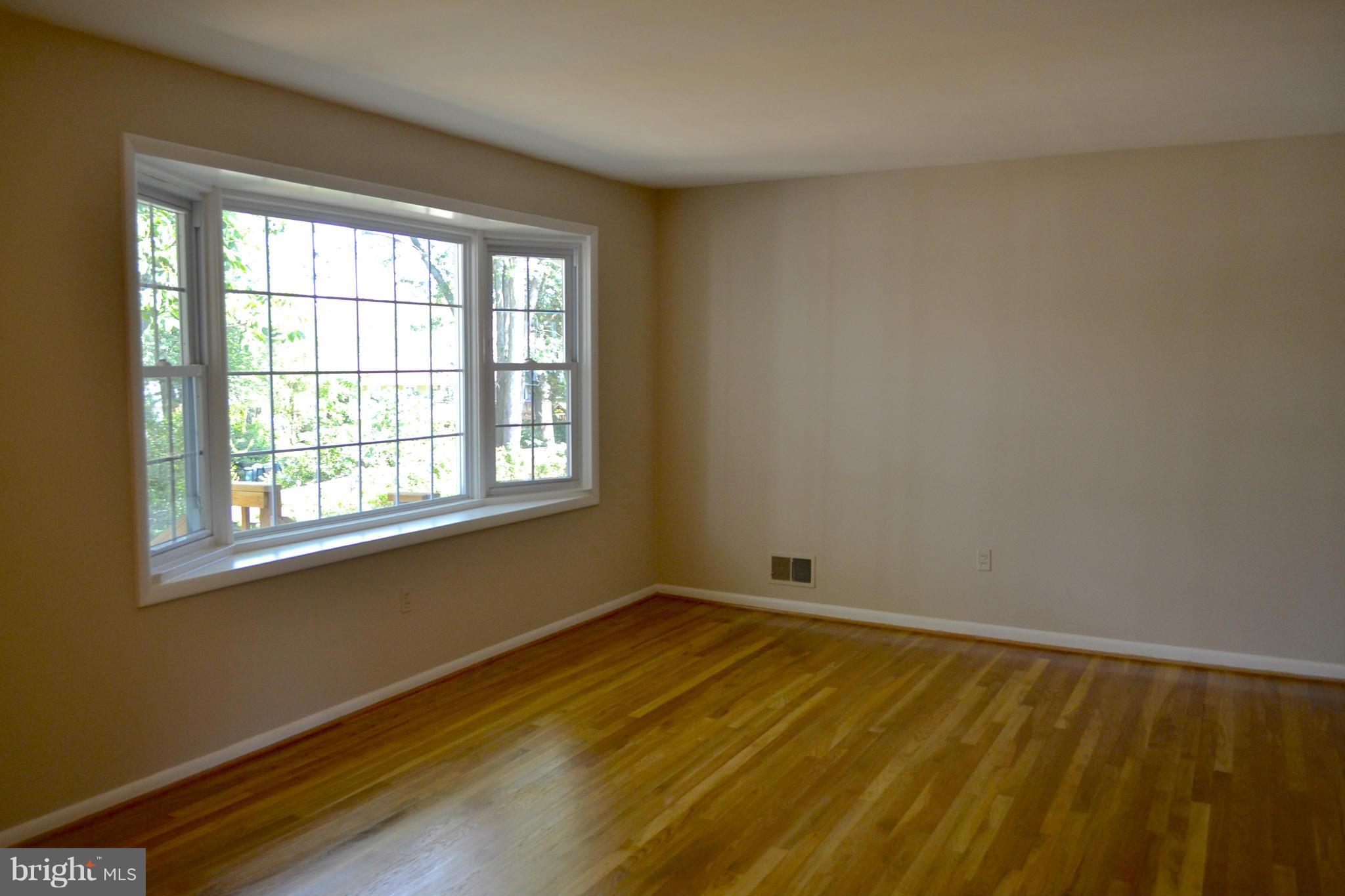 11607 Amherst Avenue Silver Spring, MD 20902 - Photo 7 of 30 Living room brightened by bay window