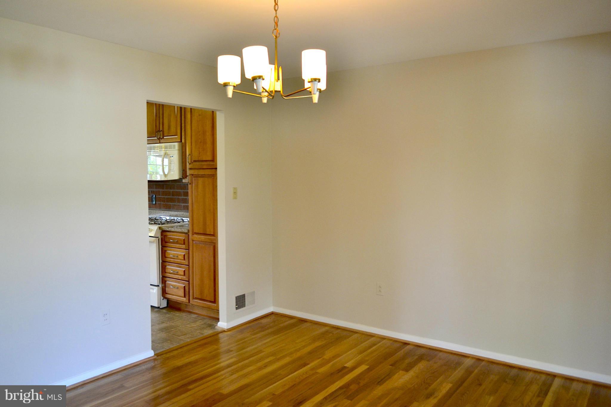 11607 Amherst Avenue Silver Spring, MD 20902 - Photo 8 of 30 Dining room is open to the living room